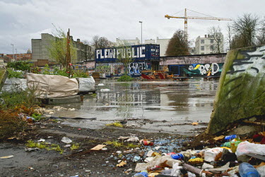 A playground in Brussels' Molenbeek neighbourhood, littered with rubbish and graffiti.