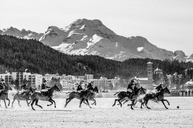 Teams Cartier and Badrutt's Palace compete during a Snow Polo match.
