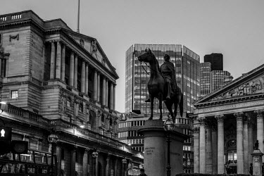 An equestrian statue of the Duke of Wellington in front of the Royal Exchange building.