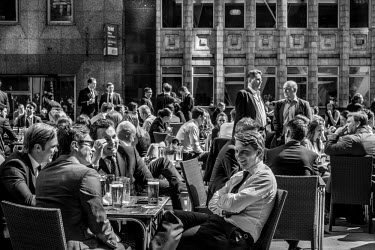 Office workers drinking beer outside a pub in the City of London.