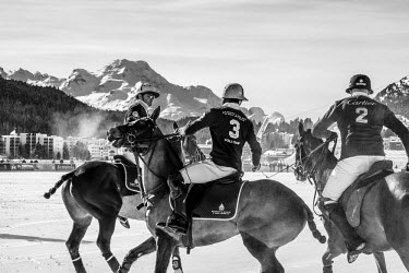 Teams Cartier and Badrutt's Palace compete during a Snow Polo match.