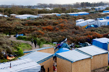 Makeshift shelters at the so-called 'Jungle', an informal settlement where several thousand migrants and asylum seekers live in dire conditions. Most want to go to the UK and try to enter illegally by...