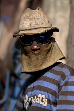 A welder with a makeshift protective mask at the Medeber metalwork market. This huge market is the centre of Asmara's recycling industry.