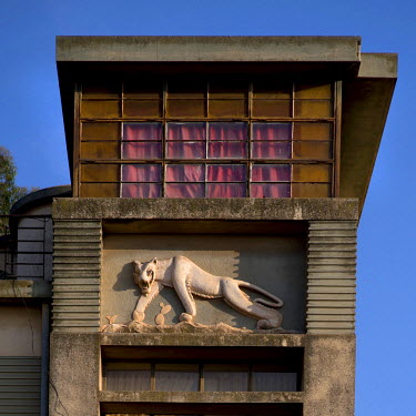 A lion bas-relief on an Art Deco style villa built in 1956 by architects Mario Fanano and Arturo Mezzedimi. Asmara is a showcase of 1930s Italian Art Deco architecture. Initially brought to the region...