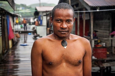 Haraga 'Speedy', 35, a gay man from Hanuabada/Elevala village. This village is considered one of the few places in PNG where gay men can live in safety. Male homosexuality is prohibited according to s...