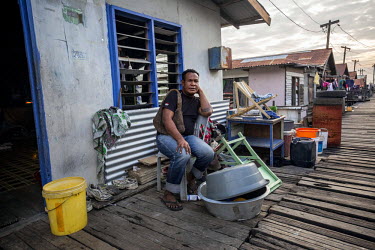 Heni waits for his friend 'Speedy' to go out in the evening. Male homosexuality is prohibited according to section 210 of the Papua New Guinea penal code and those caught engaging in anal sex can be p...
