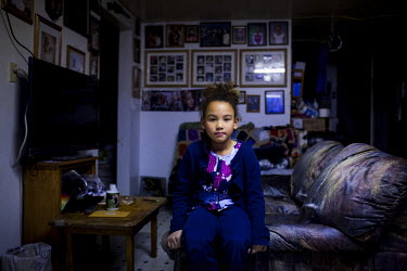 Kiyeivi, 7 at her grandparents house in Shishmaref, a barrier island with a population of less than 600 Alaska native Inupiaq people located 30 miles south of the Arctic Circle. The island is threaten...
