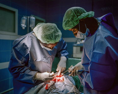 A surgeon operating a patient in a NEST private healthcare  facility. NEST offers a complete medical service for women and young children, especially paediatric and maternity services. The company was...