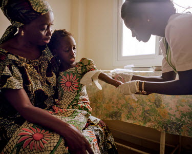 A nurse is takes a blood sample from a young child at a NEST privcate health care facility. NEST offers a complete medical service for women and young children, especially paediatric and maternity ser...