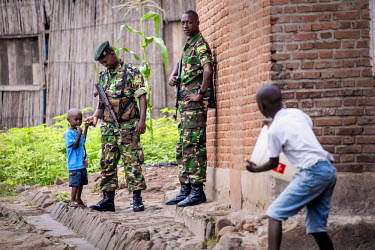 Soldiers interacting with children while they patrol in Citiboke, a neighbourhood in Bujumbura, which was at the heart of violent protests against the third mandate of President Pierre Nkurunziza.