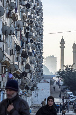 Satelitte dishes clusted to the external wall of a tenement building called 'Les Dunes', said to be the longest building in Algiers (300 metres). With its sister building, it contains a total of 840 a...