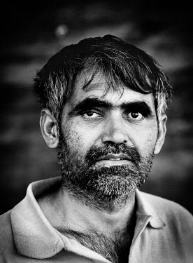 Hafoor Ahmad (38) one of ten Pakistanti boat builders constructing a traditional wooden Iranian Lenj boat in the Gouran boatyard. The workers who will be paid a thousand US Dollars a year for two year...