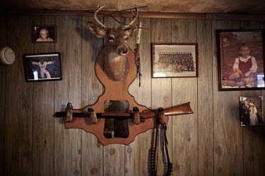 A stuffed deer's head and rifle decorate a wall in the home of Jesse Boggess. He was awarded 16 different medals during service in the Vietnam War from 1969 to 1970, including a Medal of Honor. Now he...