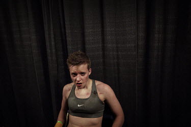 A woman after fighting in a 'Tough Man' competition. Hard.Landis a journey through rust belt and blue collar America to meet the people struggling to keep the 'American Dream' alive: middle class peop...