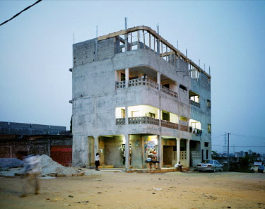 A middle class apartment block under construction in the hills above Abidjan.