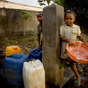 Children fetch water from one of the few wells in the village.