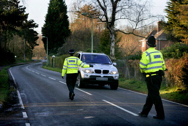 A police road block pulls over a vehicle for a routine stop as the hunt for the so-called 'Suffolk Strangler'. In December Steve Gerald Wright was arrested and charged with the murder of five sex work...