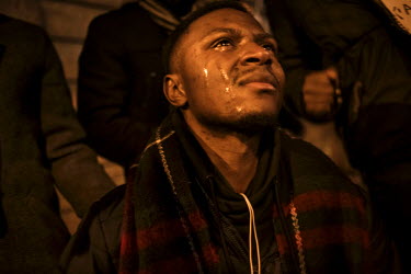 A young man in tears as he stands at the impromptu shrine to victims of the 22 March terrorist attacks that has grown up in front of the Bourse (the Stock Exchange) building. On 22 March 2016 two terr...