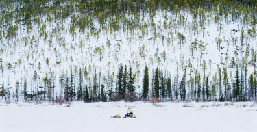 Ion Maxsimovic drives his snowmobile out to his winter hunting camp. His territory is almost half a million hectares within which owns the hunting, fishing and non-commercial timber rights.  An explos...