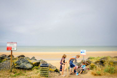 Tourists on Omaha Beach, the objective for the Americans during the D-Day landings 6 June 1944.