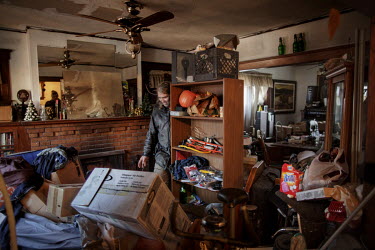 Rob Bourin (42) in one of the 20 houses he owns in Detroit. In recent years he has bought repossessed homes (foreclosures), he redecorates them slightly and rents them out to people who can not afford...