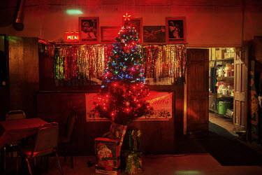 Christmas decorations and pictures of jazz greats in a bar. Hard.Land is a journey through rust belt and blue collar America to meet the people struggling to keep the 'American Dream' alive: middle cl...