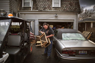 James London, AKA Big Jim, outside his home with his vehicles. He started a neigbourhood watch in Youngstown after he moved there following a jail sentence for drug trafficking. 'This neighbourhood wa...