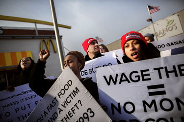 Rose Thompson (25, second from left) demonstrates outside a McDonald's restaurant in Chicago with colleagues. McDonald’s workers in California, Michigan and New York have filed lawsuits against the...