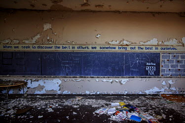 A blackboard in an abandoned school in Detroit. Hard.Landis a journey through rust belt and blue collar America to meet the people struggling to keep the 'American Dream' alive: middle class people, t...