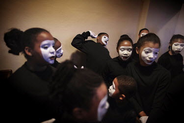 Children have their faces painted for a performance at a church service. Hard.Landis a journey through rust belt and blue collar America to meet the people struggling to keep the 'American Dream' aliv...