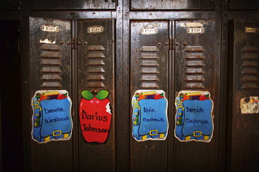 Signs on lockers with the names of the pupils that once used them at the abandoned St Rita Catholic School/Church. The population of Detroit has fallen from a high of 1,850,000 in 1950 to 701,000 in 2...
