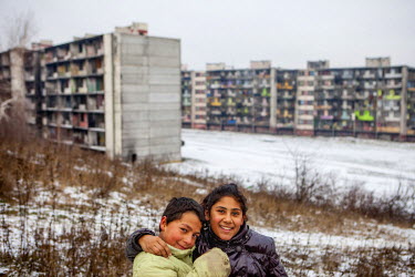 Children outside a block in the Lunik IX housing estate, a decrepit complex almost entirely populated by Roma (6542 residents registered as living there in 2015). The concrete buildings are in appalli...