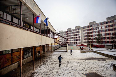 EU and Slovakian flags hang from the town hall building in the Lunik IX housing estate, a decrepit complex almost entirely populated by Roma (6542 residents registered as living there in 2015). The co...
