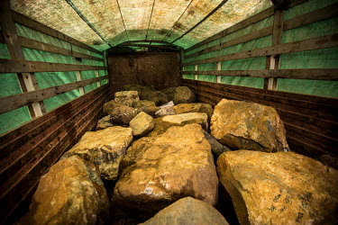 A truck fully-loaded with jade-bearing rocks waiting for government tax evaluation, prior to getting permission for transportation. According to several black market jade traders, all the raw jade tra...
