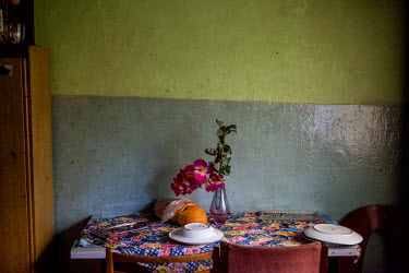 Bread and flowers on a table in a flat in the Lunik IX housing estate, a decrepit complex almost entirely populated by Roma (6542 residents registered as living there in 2015). The concrete buildings...