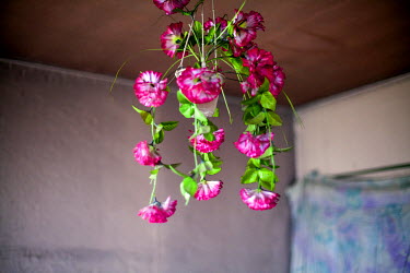 Artificial flowers hanging from the ceiling in a flat in the Lunik IX housing estate. The decrepit complex is almost entirely populated by Roma, with 6542 residents registered in 2015. Living conditio...