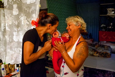Darina with her daughter Jana and her new born granddaughter in their falt in the Lunik IX housing complex. Most of the buildings on the estate are in appalling condition but the block she lives in is...