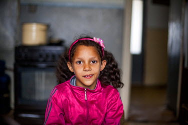 A young girl in a flat on the Lunik IX estate that is occupied by two families. Most of the buildings on the estate are in appalling condition, often lacking heating, electricity and water. The decrep...