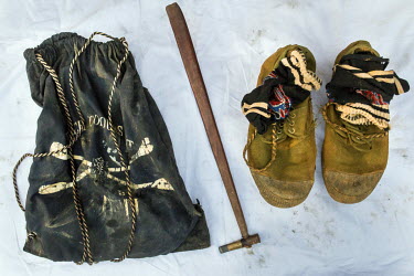 The belongings of Zaw Win Maung, killed by a backhoe digger as he searched in a commercial jade mine's waste dump. He left a wife and five year old son, his family say they have received no compensati...