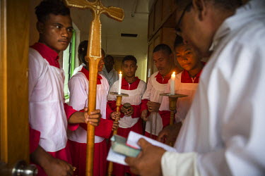 Anglican priest Father Steven Kakoa (right), and his acolytes preparing for a service at the Transfiguration Anglican Church of Melanesia in Lord Howe Settlement which is populated by people from Ont...