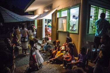 Lord Howe Settlement's residents gather near Transfiguration Anglican Church�during an evening service. The district is populated by people from Ontong Java Atoll (AKA Lord Howe Atoll), a Polynesian o...