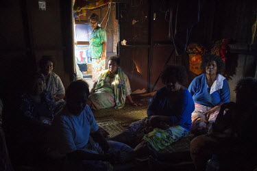 Women from Lord Howe Settlement gather in a house during a funeral. By local tradition the body of the deceased should be brought back to their home atoll to be buried. However, community leaders are...