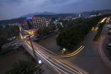 Traffic passes through the centre of the town of Mong La. The influx of gamblers into Mong La's casinos has triggered a boom in prostitution with much of the central town now a red-light distric.  The...