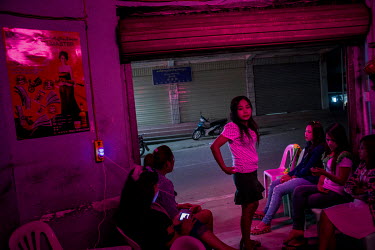 Burmese sex workers wait for customers in a bar in Mong La.  The town of Mong La on the Burma - China border in western Burma (Myanmar) is technically in Burma but relies on most infrastructure - elec...