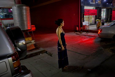 A sex-worker waits for customer near the market of Mong La.  The town of Mong La on the Burma - China border in western Burma (Myanmar) is technically in Burma but relies on most infrastructure - elec...