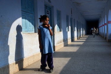 A young girl dressed in blue at the Sanatan Seva Mandal school and orphanage (about half of the children are orphans) in Dwarka which provides an education for 435 students whose parents can't afford...