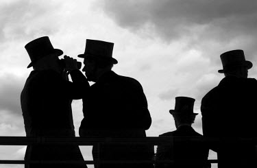 Racegoers watch the race in he Royal Enclosure at Ascot racecourse. Royal Ascot is one of the world's most famous race meetings which dates back to 1711. In June each year, the Queen attends the meeti...