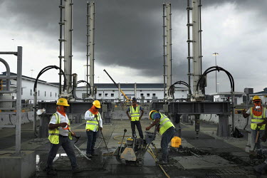 Staff working on the filling valves for a water reservoir during construction work for the Panama Canal Expansion which will allow ships specified as New Panimax, 320.04m (1,050ft) (l) x 33.54m (110ft...