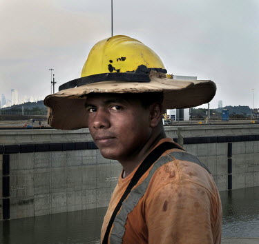 A gardener employed during construction work for the Panama Canal Expansion which will allow ships specified as New Panimax, 320.04m (1,050ft) (l) x 33.54m (110ft) (w) x 12.56m (41.2ft) (d), to pass t...