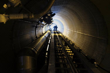 A man climbs a ladder inside one of the giant locks built during the Panama Canal Expansion project. When the Panama Canal Expansion is complete, 26 June 2016, ships specified as New Panimax, 320.04m...